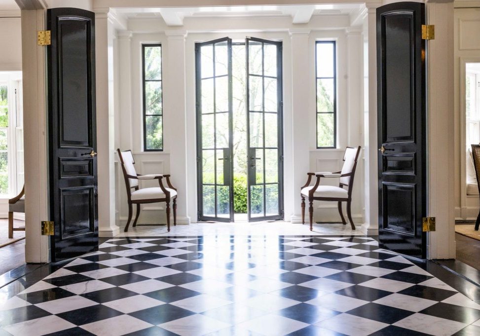 Traditional foyer with black and white checkered tile flooring (Different view)